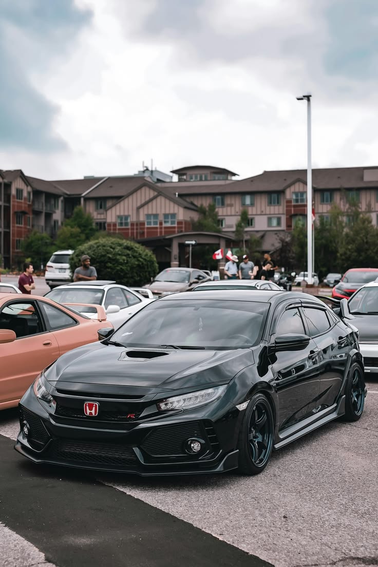 Blacked out Honda Civic Type R with chrome delete at car meet