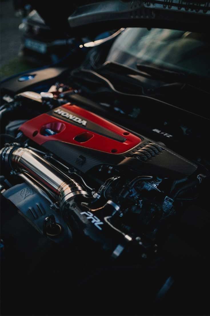Honda engine bay with PRL cold air intake and red Honda valve cover