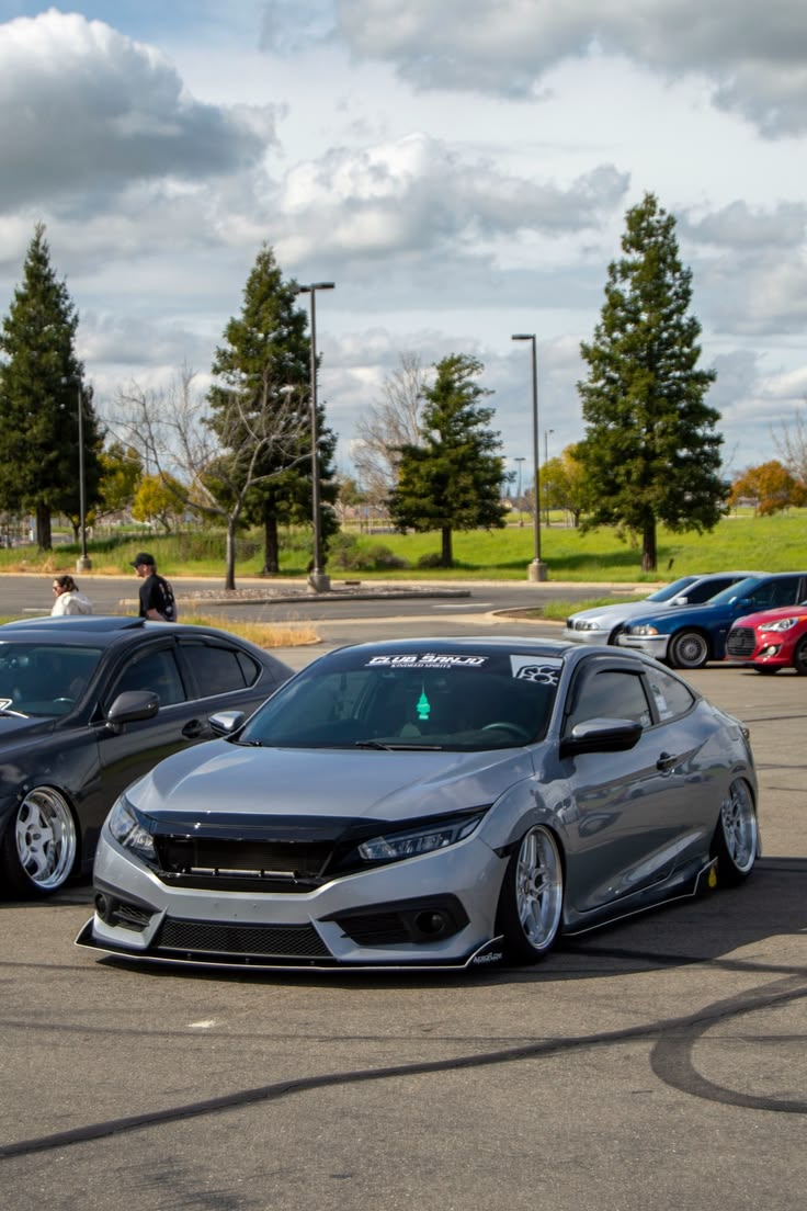 Silver Honda Civic sedan slammed on coilovers at car meet