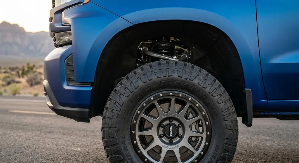 Close-up of tire and fender clearance on a leveled Chevrolet Silverado 1500